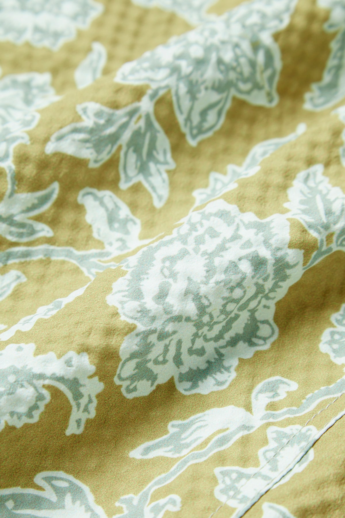 PISTACHIO FLOWER SWIM TRUNKS
